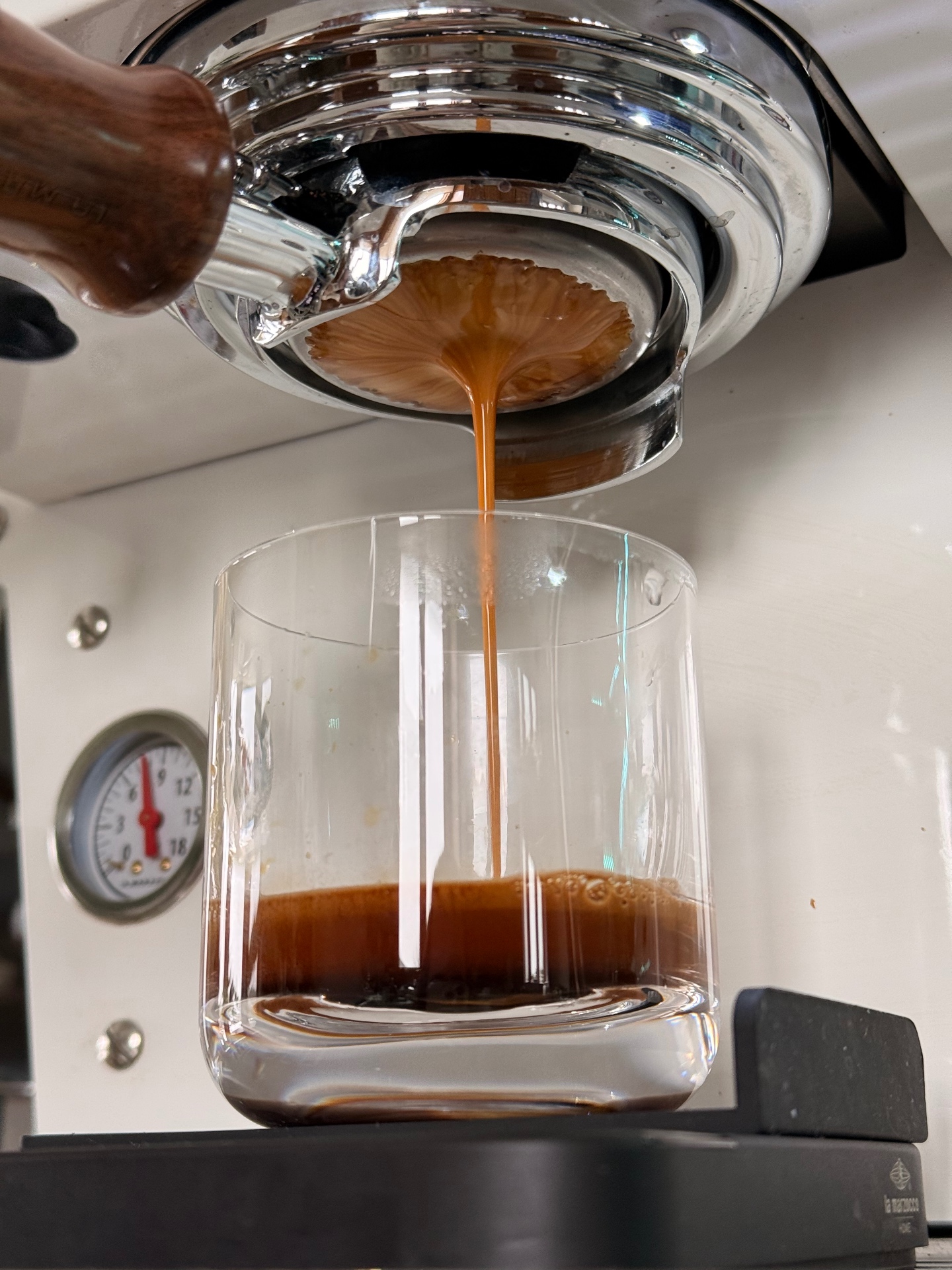 Espresso extraction close-up on La Marzocco