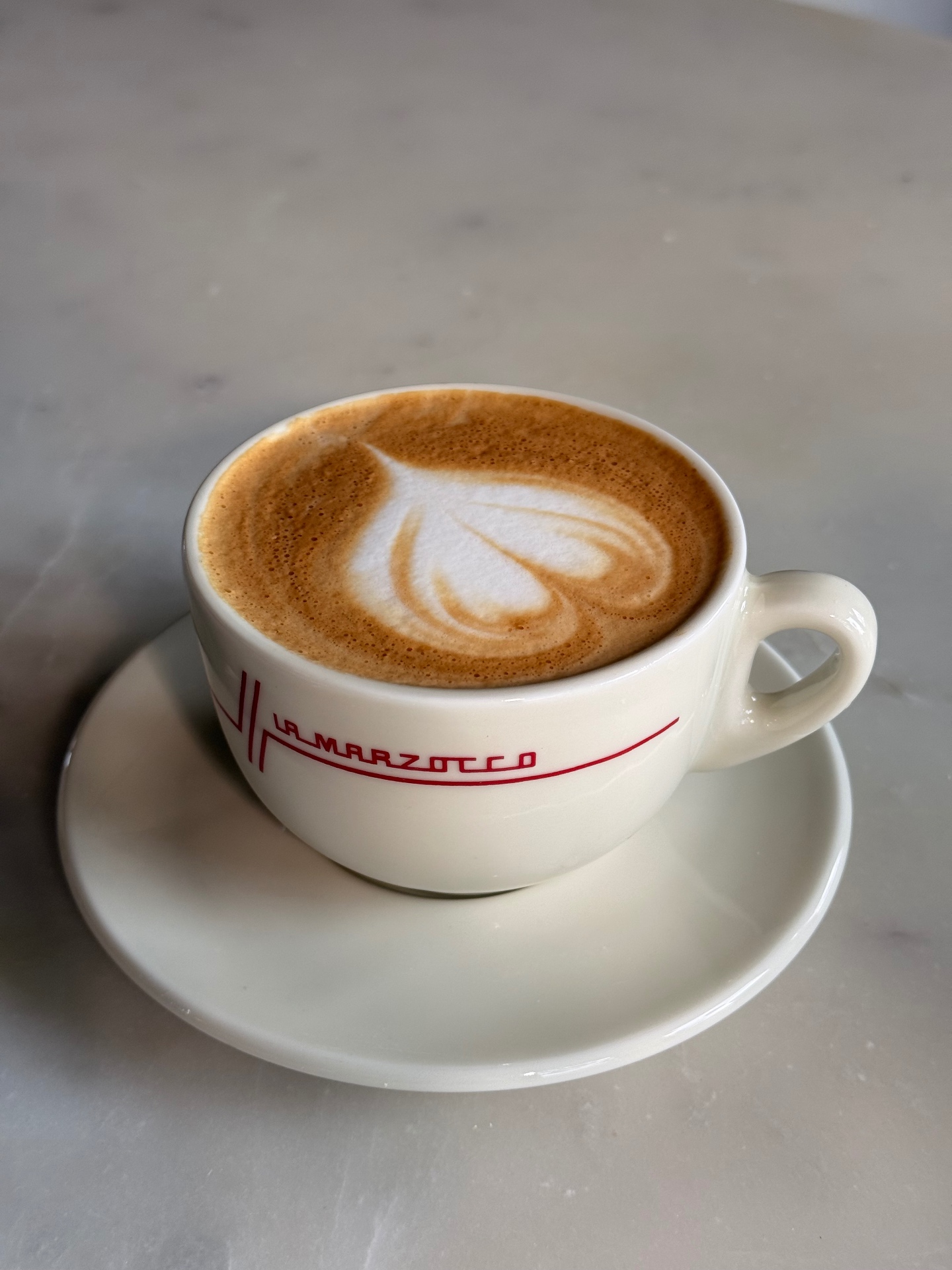 Cappuccino with hand-poured latte art on La Marzocco